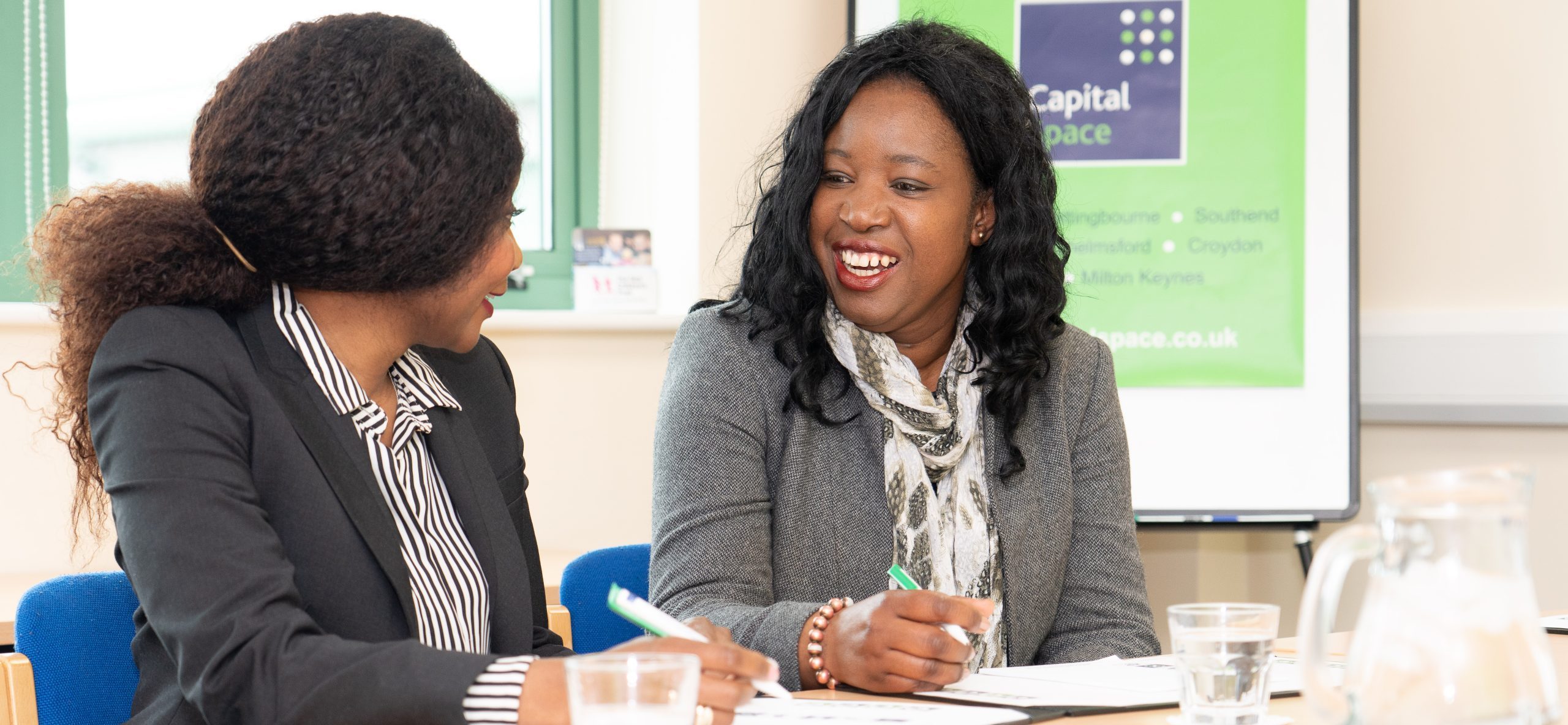 Two business customers in a meeting room